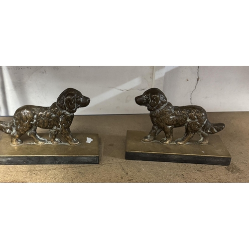 41 - Pair cast brass dog door stops