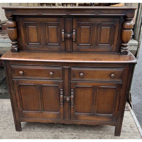 493 - Ercol oak court cupboard