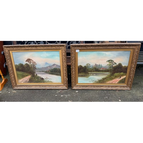 712A - pair large oils river landscapes