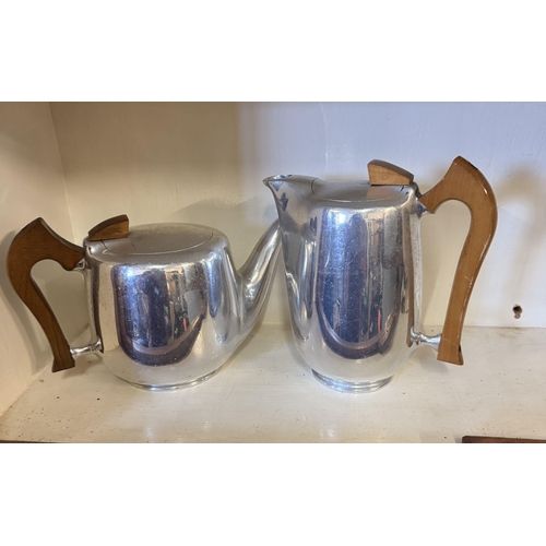 563 - Pair piquet teapots