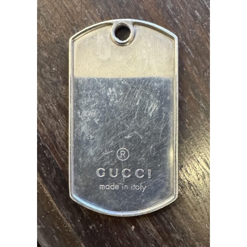 751 - Gucci tag