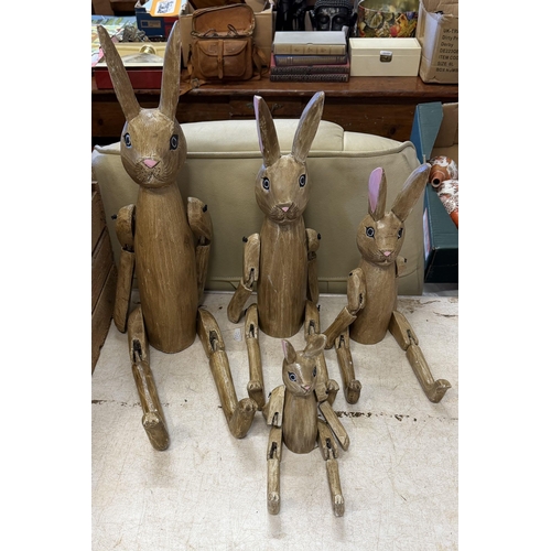 4 wooden jointed rabbits