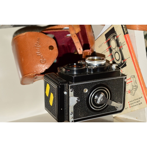 402 - A ROLLEIFLEX 3.5 B TWIN LENS REFLEX CAMERA, in leather case and fitted with a Heidoscop 2.8 Anastigm... 