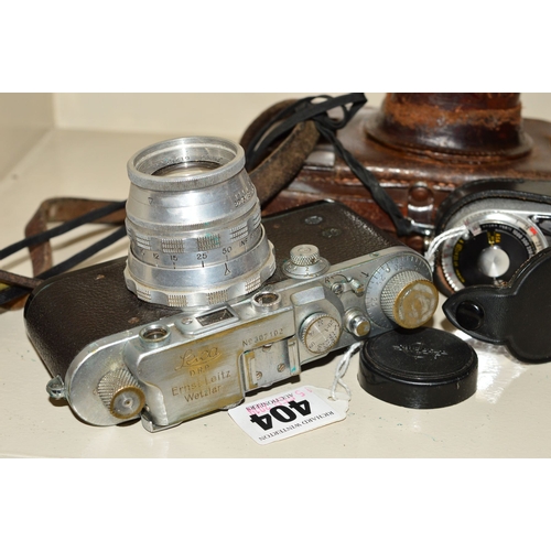 404 - A LEICA IIIA CAMERA IN ORIGINAL LEATHER CASE, fitted with a Cooke Amotal Anastigmat 2'' f2 lens, man... 