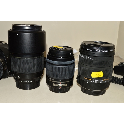 406 - A PENTAX K-X SR DIGITAL SLR CAMERA, fitted with a DA L 18-55mm f3.5 AL lens, a Pentax DA L 50mm-200m... 