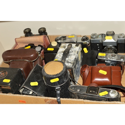 420 - A TRAY OF CAMERAS AND BINOCULARS, including a Rollei B35, Taron, Praktica, Zenith, etc