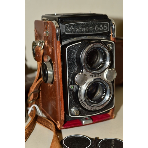 488 - A YASHICA 635 TRL CAMERA, fitted with 80mm f3.5 lenses, a Zenit EM fitted with Helios 58mm f2 lens a... 