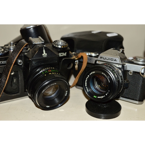 488 - A YASHICA 635 TRL CAMERA, fitted with 80mm f3.5 lenses, a Zenit EM fitted with Helios 58mm f2 lens a... 