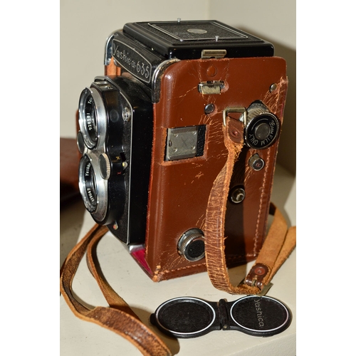 488 - A YASHICA 635 TRL CAMERA, fitted with 80mm f3.5 lenses, a Zenit EM fitted with Helios 58mm f2 lens a... 