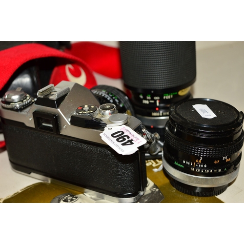 490 - A CANON AV-1 FILM SLR CAMERA, fitted with a Sigma 28mm f2.8 lens, a Canon FD 50mm f1.8, a Vivitar 75... 