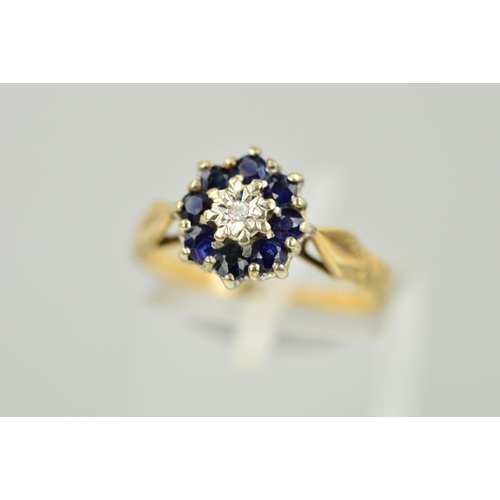 134 - A 9CT GOLD SAPPHIRE AND DIAMOND CLUSTER RING, a central single cut diamond within an illusion settin... 