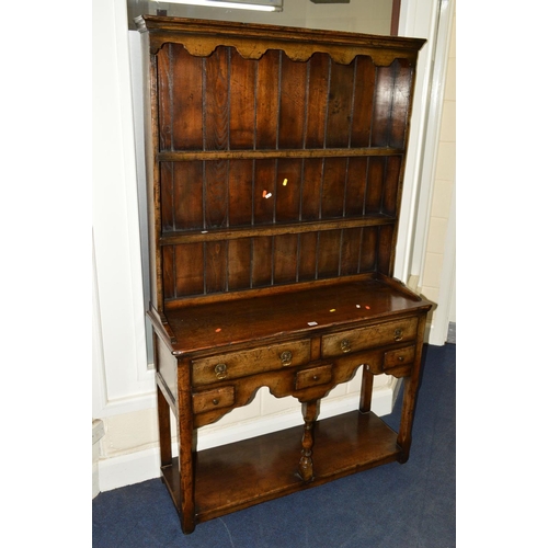 1537 - A NARROW TITCHMARSH AND GOODWIN OAK DRESSER the upper section with a two tier plate rack above a bas... 