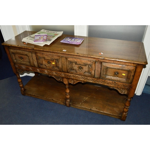 1538 - A TITCHMARSH AND GOODWIN OAK DRESSER BASE, the four drawers with geometric front, central rail with ... 