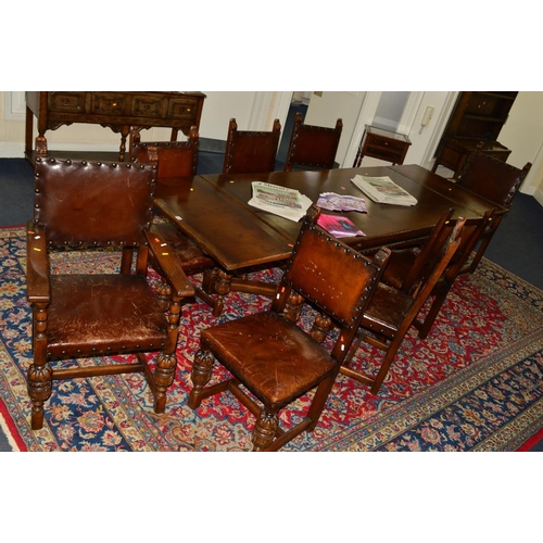 1539 - A LARGE REPRODUCTION OAK CROSS STRETCHERED DRAW LEAF TABLE on four large acorn supports, approximate... 