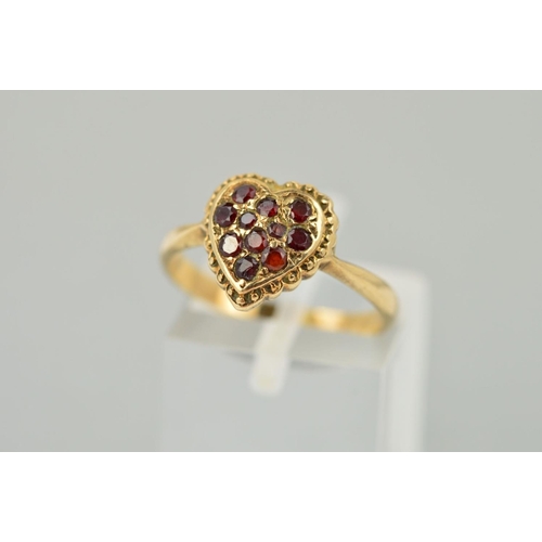 183 - A MID TO LATE TWENTIETH CENTURY GARNET HEART SHAPED CLUSTER RING, ring size M, stamped '9ct', approx... 