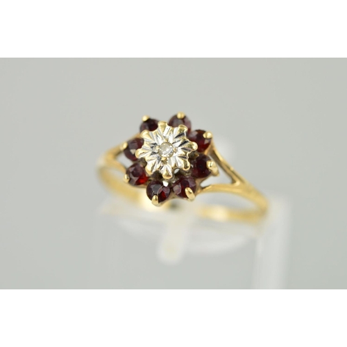 184 - A 9CT GOLD LATE TWENTIETH CENTURY GARNET AND DIAMOND ROUND CLUSTER RING, ring size M 1/2, hallmarked... 