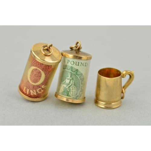 207 - THREE 9CT GOLD CHARMS, to include a tankard, a cased ten shilling note and a cased one pound note, a... 