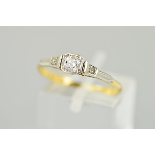 210 - A DIAMOND RING, the central brilliant cut diamond within a square shape surround to the tapered sing... 