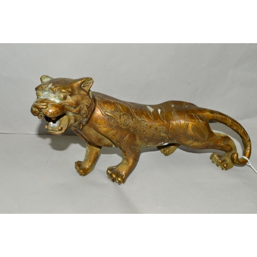 813 - A BRASS ORIENTAL STYLE TIGER, approximate length 35cm