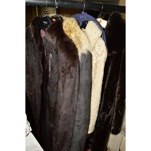 629 - A LONG VINTAGE FUR COAT, a sheepskin long belted coat with fur trim and two other coats (4)