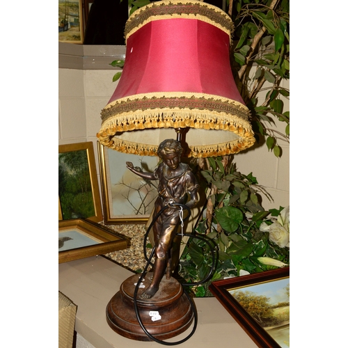 614 - A BRONZE FIGURE OF A YOUNG MAN, mounted onto a wooden plinth, with lamp fittings and shade