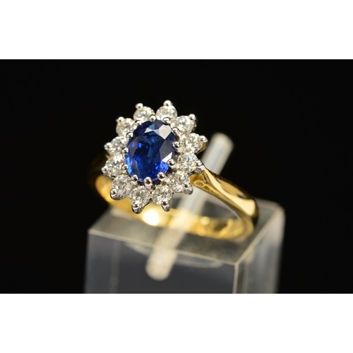 1 - A MODERN 18CT GOLD SAPPHIRE AND DIAMOND OVAL CLUSTER RING, oval blue sapphire measuring approximatel... 