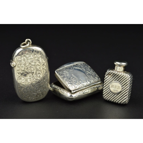 101 - AN EDWARDIAN SILVER SNUFF BOX, of rectangular form, foliate engraved decoration surrounding a shield... 