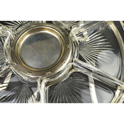 103 - A GEORGE V SILVER CIRCULAR HORS D'OEUVRES TRAY, with fixed carry handle above the open frame, fitted... 