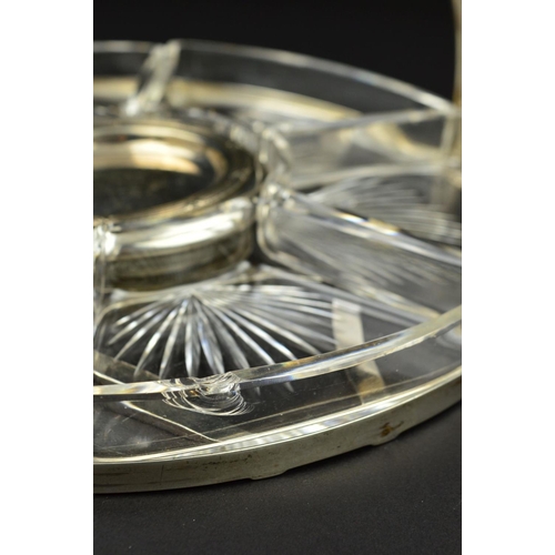 103 - A GEORGE V SILVER CIRCULAR HORS D'OEUVRES TRAY, with fixed carry handle above the open frame, fitted... 