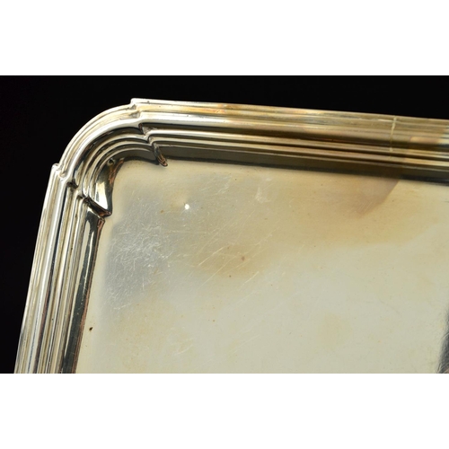 107 - AN EDWARDIAN BRITANNIA STANDARD SILVER SALVER, of square form, rounded corners, stepped banding to b... 