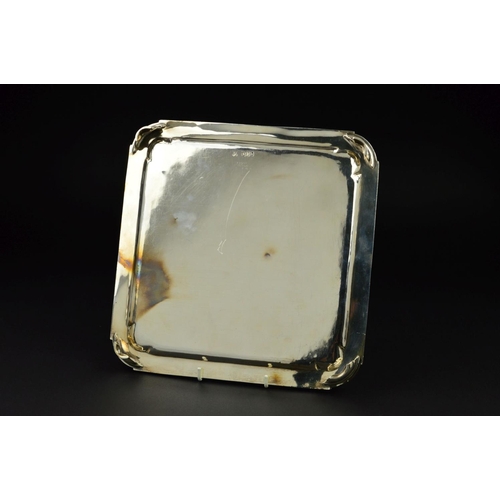 107 - AN EDWARDIAN BRITANNIA STANDARD SILVER SALVER, of square form, rounded corners, stepped banding to b... 