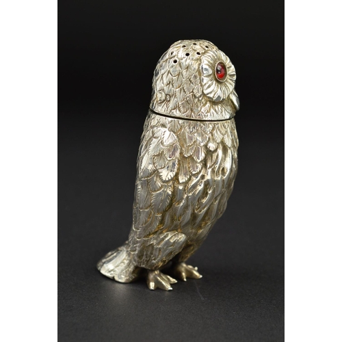 108 - A VICTORIAN SILVER NOVELTY PEPPERETTE, in the form of an Owl, with pull off cover and set with red a... 