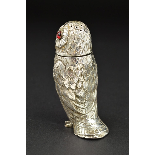 108 - A VICTORIAN SILVER NOVELTY PEPPERETTE, in the form of an Owl, with pull off cover and set with red a... 