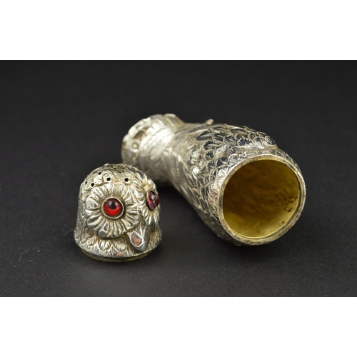 108 - A VICTORIAN SILVER NOVELTY PEPPERETTE, in the form of an Owl, with pull off cover and set with red a... 