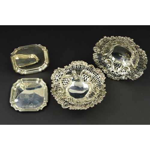 110 - A PAIR OF LATE VICTORIAN SILVER BON BON DISHES, of wavy circular form, pierced and repousse decorate... 