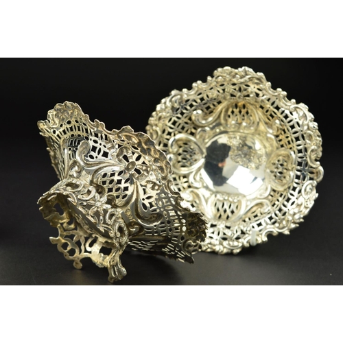 110 - A PAIR OF LATE VICTORIAN SILVER BON BON DISHES, of wavy circular form, pierced and repousse decorate... 