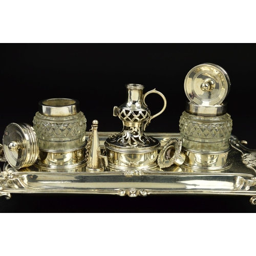 112 - A GEORGE III SILVER SHAPED RECTANGULAR INKSTAND, fitted with a central taperstick with removable sco... 