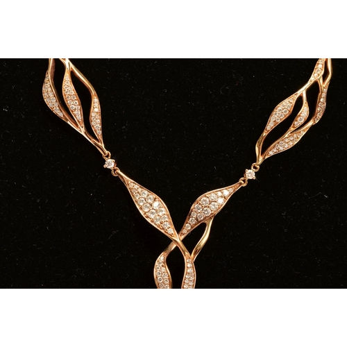 12 - A MODERN 18CT ROSE GOLD DIAMOND SET CENTRE PIECE NECKLET, comprised of open twist design links, esti... 