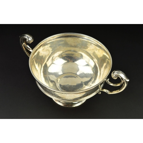 120 - A LATE VICTORIAN SILVER TWIN HANDLED TROPHY CUP, of circular form, cast scrolling handles, the cup w... 