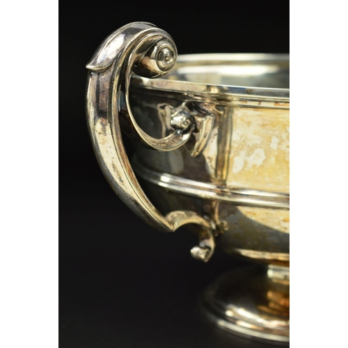 120 - A LATE VICTORIAN SILVER TWIN HANDLED TROPHY CUP, of circular form, cast scrolling handles, the cup w... 