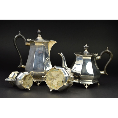 122 - A GEORGE V SILVER FOUR PIECE TEA SERVICE, of octagonal baluster form, 'S' scroll handles, ebony fitm... 