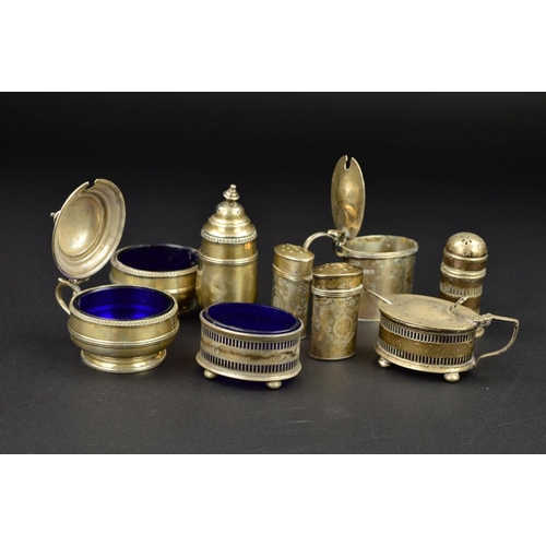 124 - THREE SETS OF SILVER THREE PIECE CRUET SETS, two of oval form and one circular, the circular and pie... 