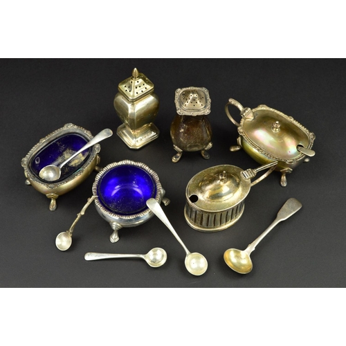 132 - A PARCEL OF SILVER CRUET ITEMS, including a three piece set of shaped oval form with cast rims and o... 