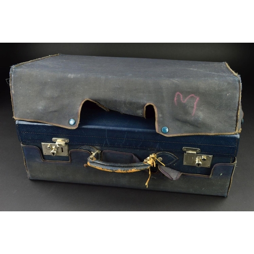 133 - A GEORGE V BLUE LEATHER SUITCASE, with canvas outer cover, the case interior with water marked blue ... 