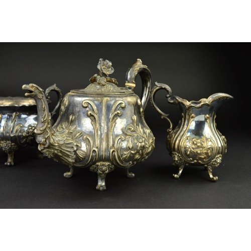 135 - A VICTORIAN SILVER PLATED THREE PIECE TEA SERVICE, of baluster form, embossed foliate decoration, wi... 