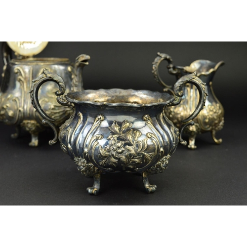 135 - A VICTORIAN SILVER PLATED THREE PIECE TEA SERVICE, of baluster form, embossed foliate decoration, wi... 