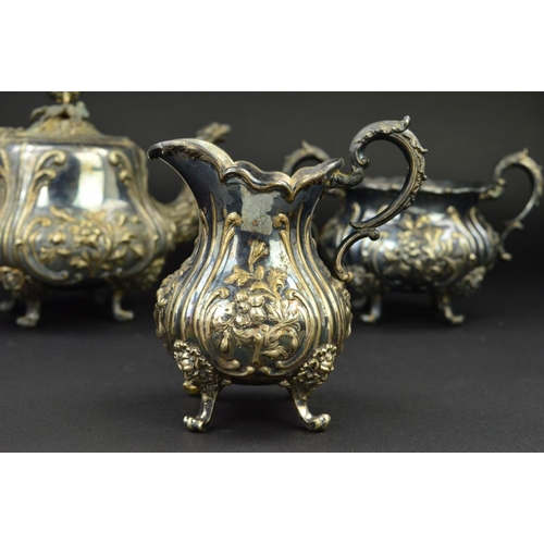 135 - A VICTORIAN SILVER PLATED THREE PIECE TEA SERVICE, of baluster form, embossed foliate decoration, wi... 