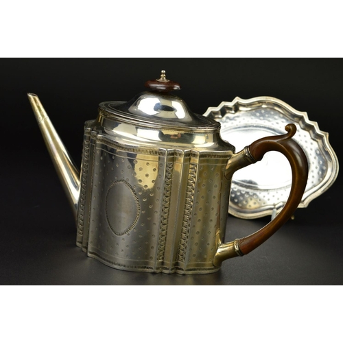 138 - A GEORGE III SILVER TEAPOT AND STAND, of serpentine outline, dome oval hinged cover with fruitwood f... 