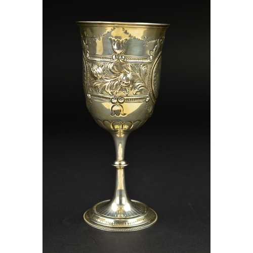 140 - A VICTORIAN SILVER GOBLET, repousse and punched foliate, scroll and swag decoration, beaded foot rim... 