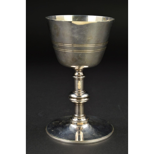 141 - A LATE VICTORIAN SILVER PLATED COMMUNION CHALICE, concentric band decoration, knopped stem, circular... 